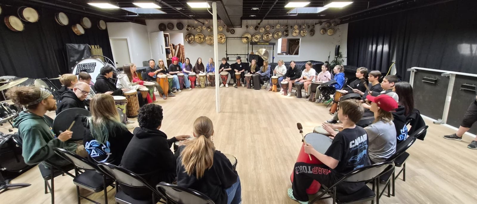 A team drumming together
